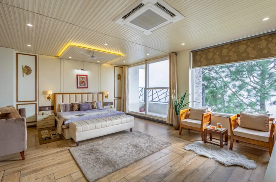 Luxury king room with king-size bed, expansive layout, elegant furniture, large windows, soft lighting, and calming interior design